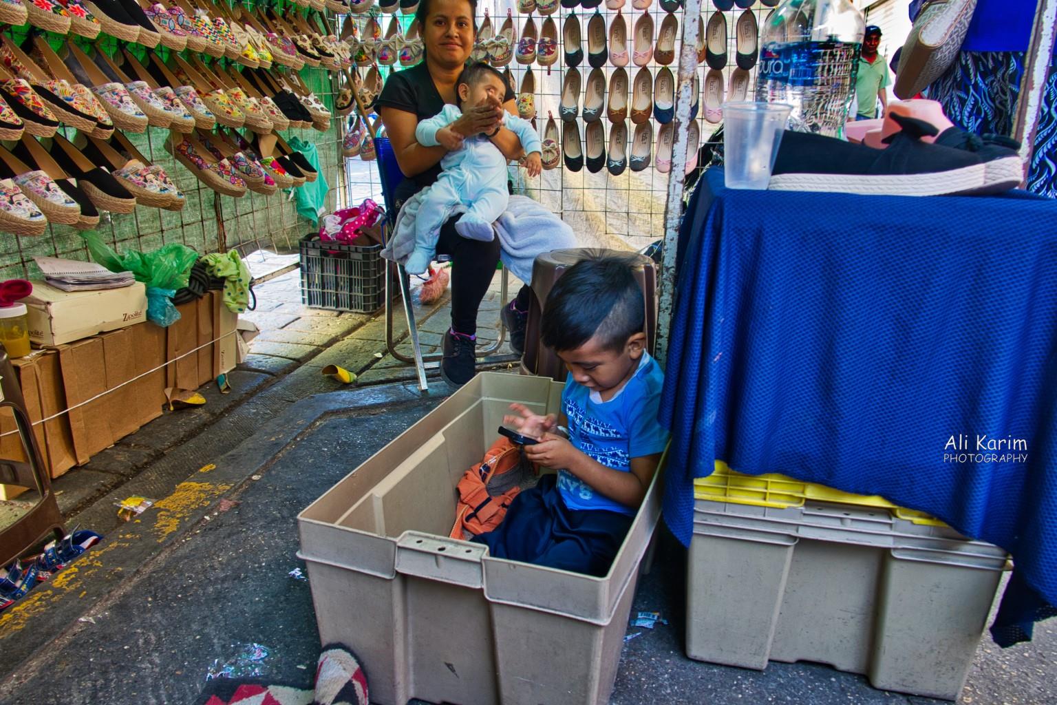 The whole family helps out with taking care of the shop Oaxaca, Mexico The whole family helps out with taking care of the shop