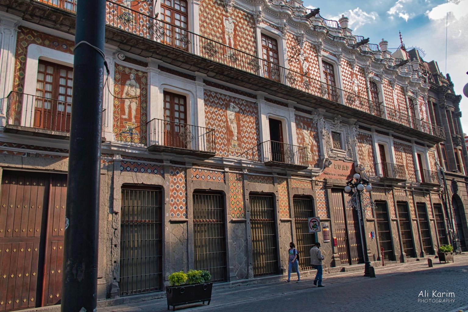 The tiles covering the walls are unique in this area and called Talavera tiles. On these buildings, decorative figures in Talavera tilework are added Puebla, Mexico Dec 2020, The tiles covering the walls are unique in this area and called Talavera tiles. On these buildings, decorative figures in Talavera tilework are added