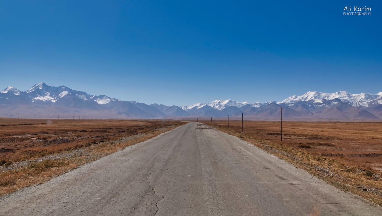 Road south from Sary Tosh to Tajikistan, along the Pamir highway. Pamir mountains in the distance Silk Road 18: Murghab, Tajikistan Road south from Sary Tosh to Tajikistan, along the Pamir highway. Pamir mountains in the distance
