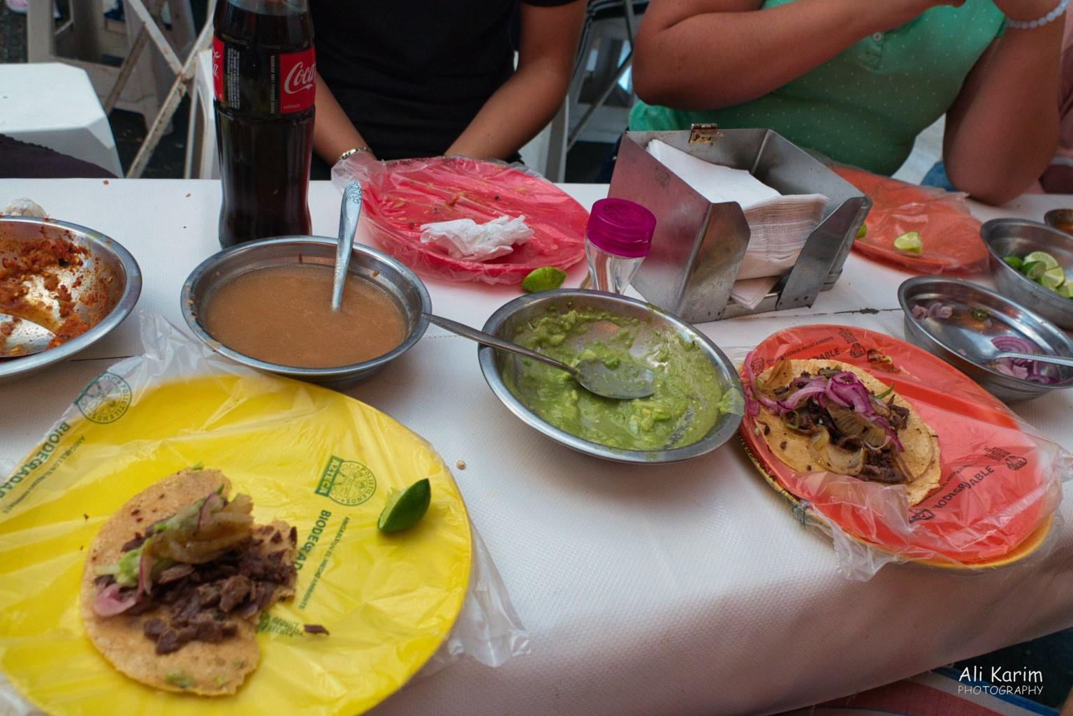 Mexico City, Mexico, Dec 2019, Tacos were served on plates covered in a thin clear plastic bag; the salsa's were quite spicy