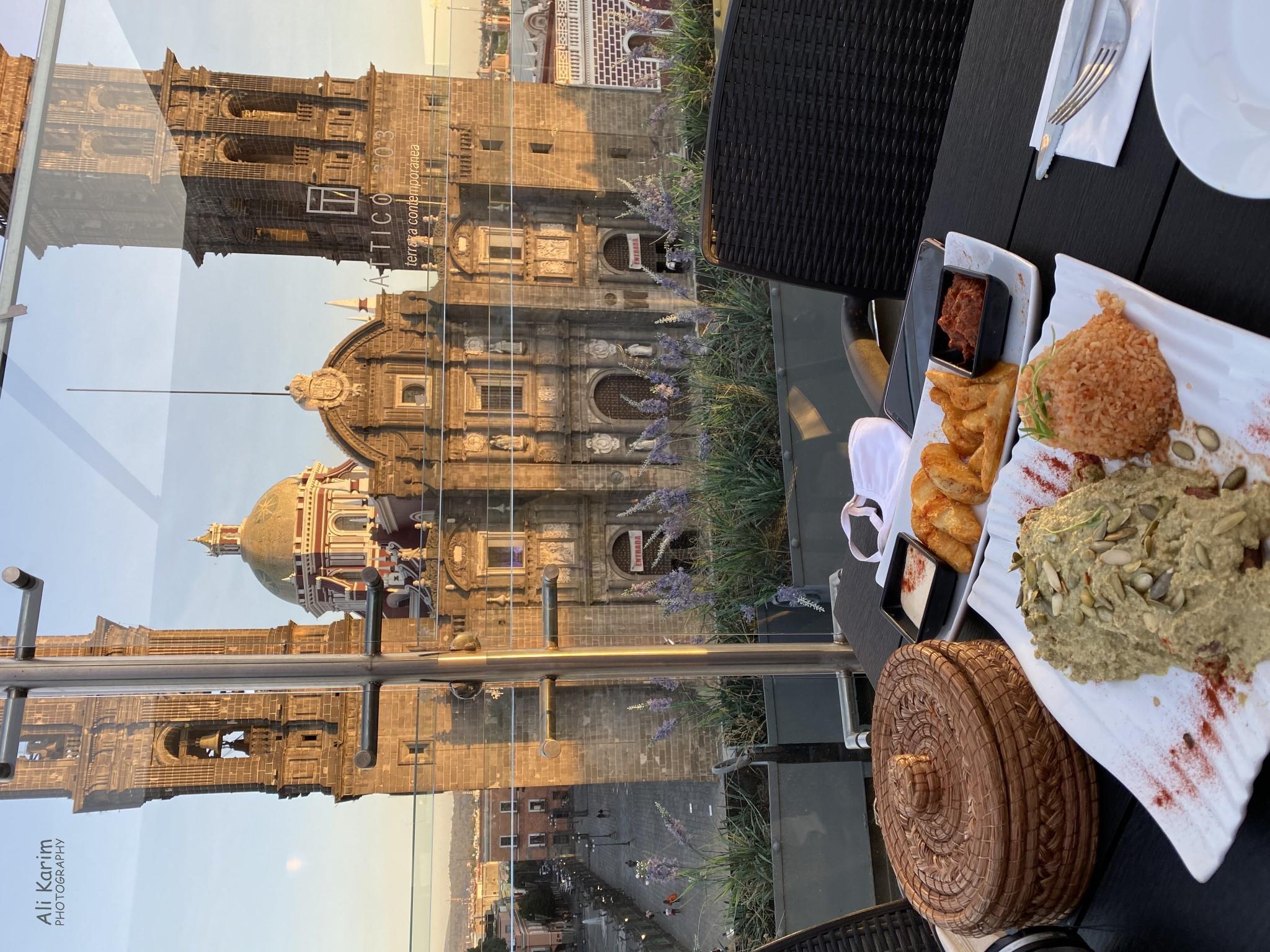 Puebla, Mexico Dec 2020, Rooftop restaurant in the zocalo with a great view of the Cathedral. Again, note the food, presentation, plates etc