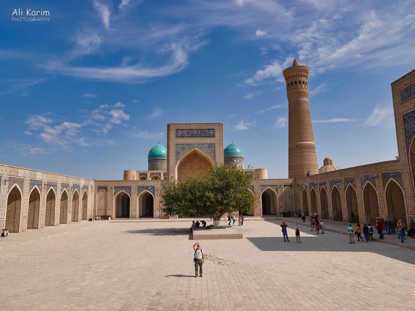 Inside the huge and impressive Kalyan mosque, with the equally impressive Kalyan minaret. The blue domes in the back belonged to the Mir Arab madrassah opposite the mosque. The mosque was designed to hold 12,000 worshippers Bukhara, Oct 2019, Inside the huge and impressive Kalyan mosque, with the equally impressive Kalyan minaret. The blue domes in the back belonged to the Mir Arab madrassah opposite the mosque. The mosque was designed to hold 12,000 worshippers